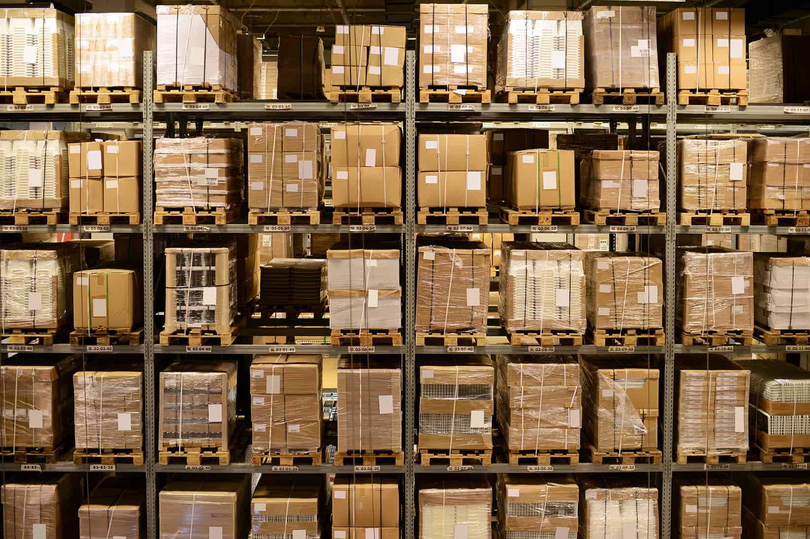 Warehouse with shelves that are filled with packages